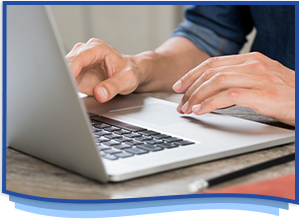 Man typing on laptop computer