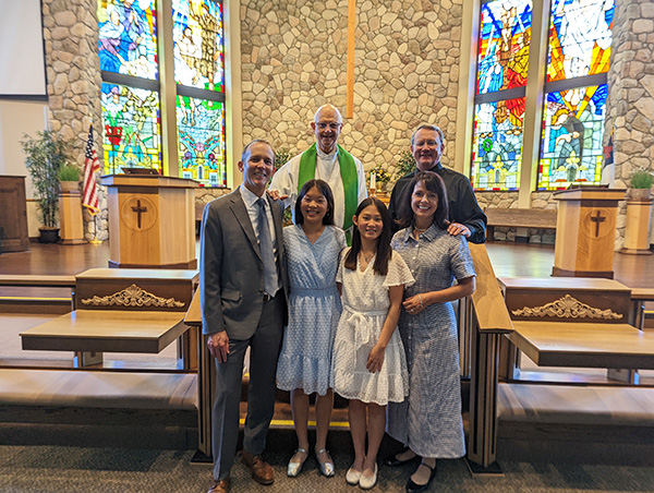 Matt Wasmund and his family in front of the church altar